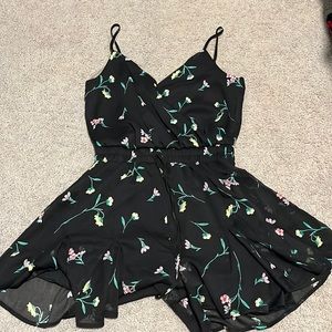Trixxi clothing company; Black romper with floral pattern, Size small.